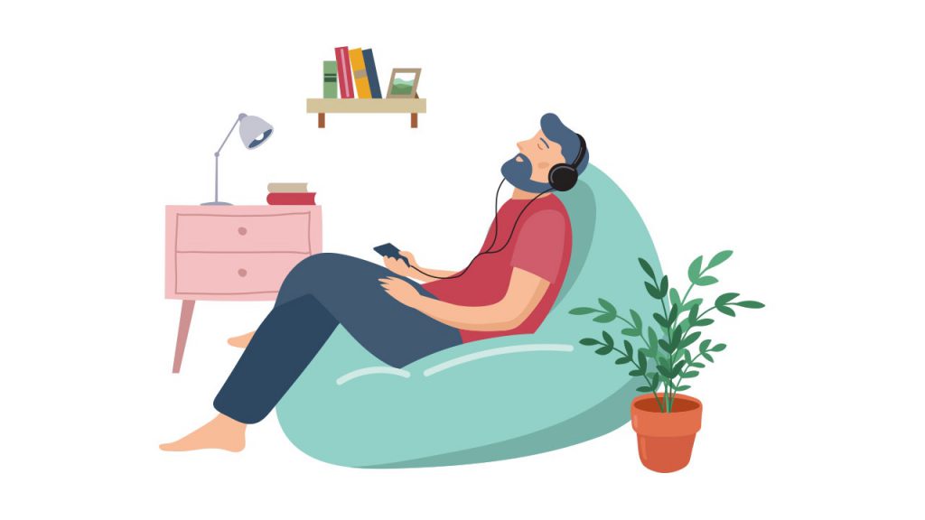 armut koltukta oturup müzik dinleyen adam